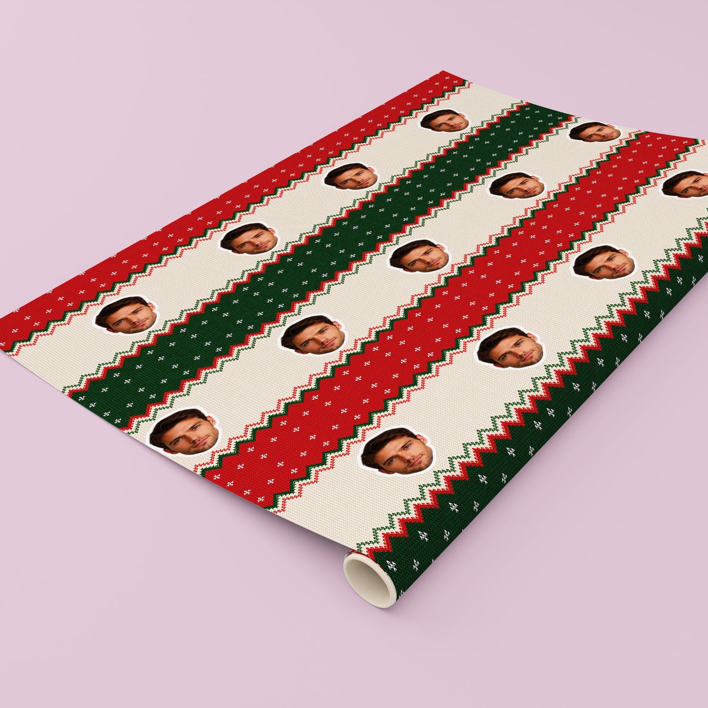 Funny personalised face Christmas gift wrap with red and green Christmas jumper design.
