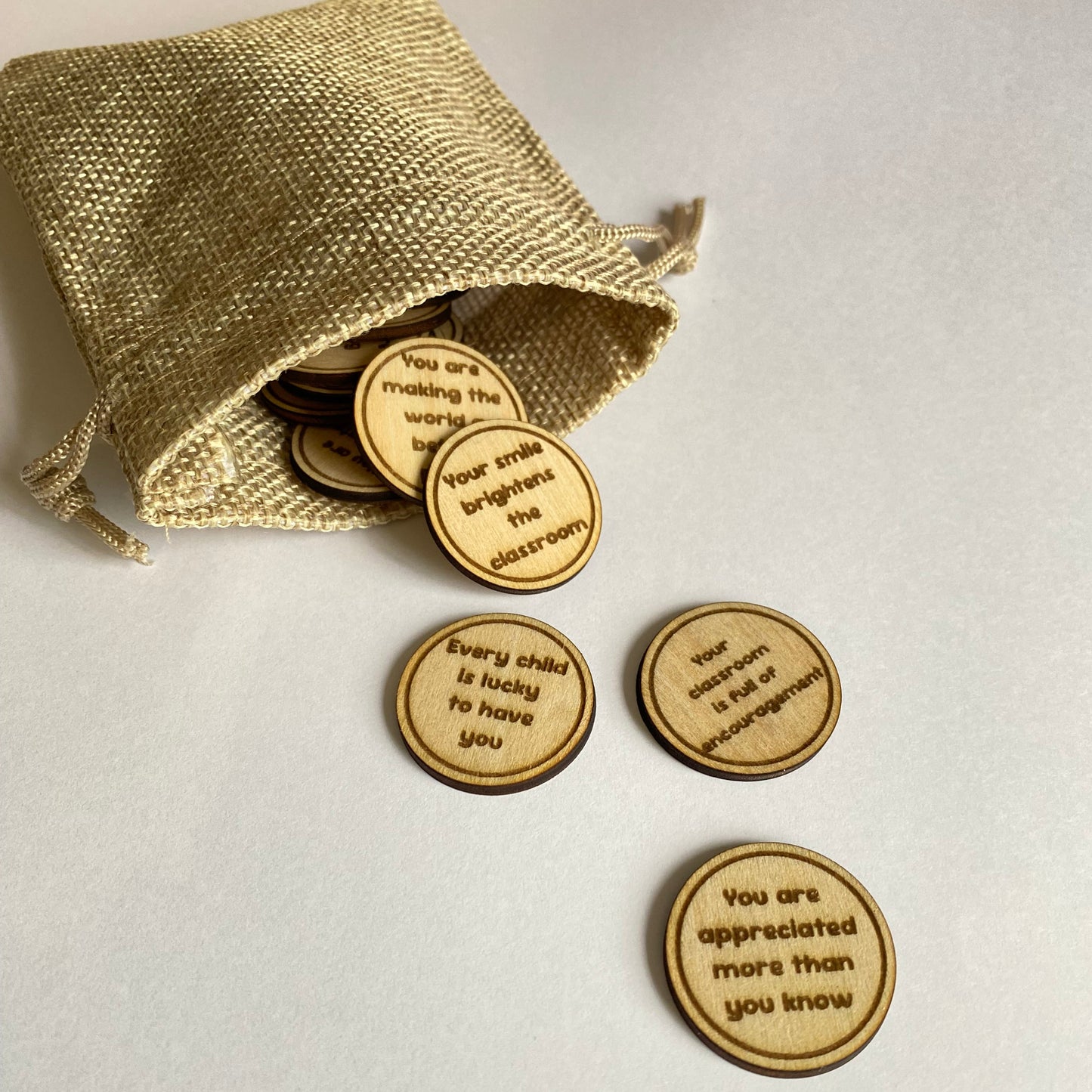 Engraved wooden teacher appreciation tokens with thoughtful affirmations, ideal as a thank you gift for teachers.