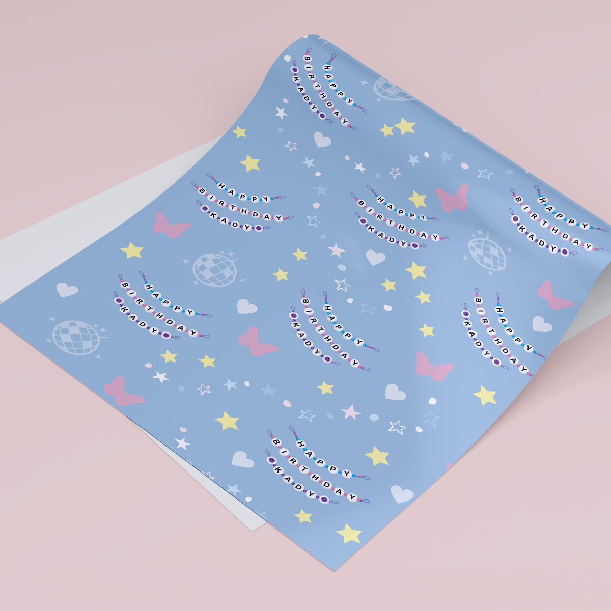 Blue wrapping paper with "happy birthday" friendship bracelets