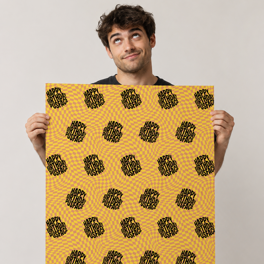 Happy Birthday Pusface wrapping paper featuring a yellow and orange retro optical illusion pattern with bold black text.