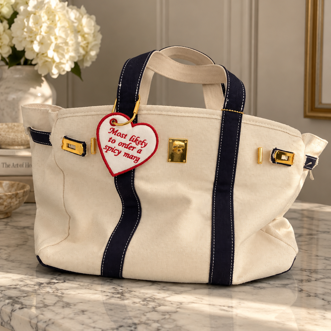Heart-shaped “Most Likely to Order a Spicy Marg” bag tag, a fun accessory for handbags, luggage and travel bags.